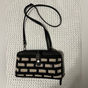 Black and cream colored Sak crossbody